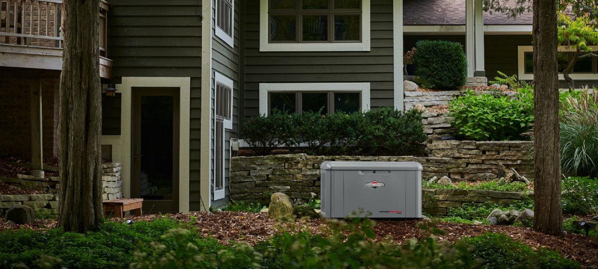 Briggs & Stratton 26kW PowerProtect Generator Installed in a large home's backyard.